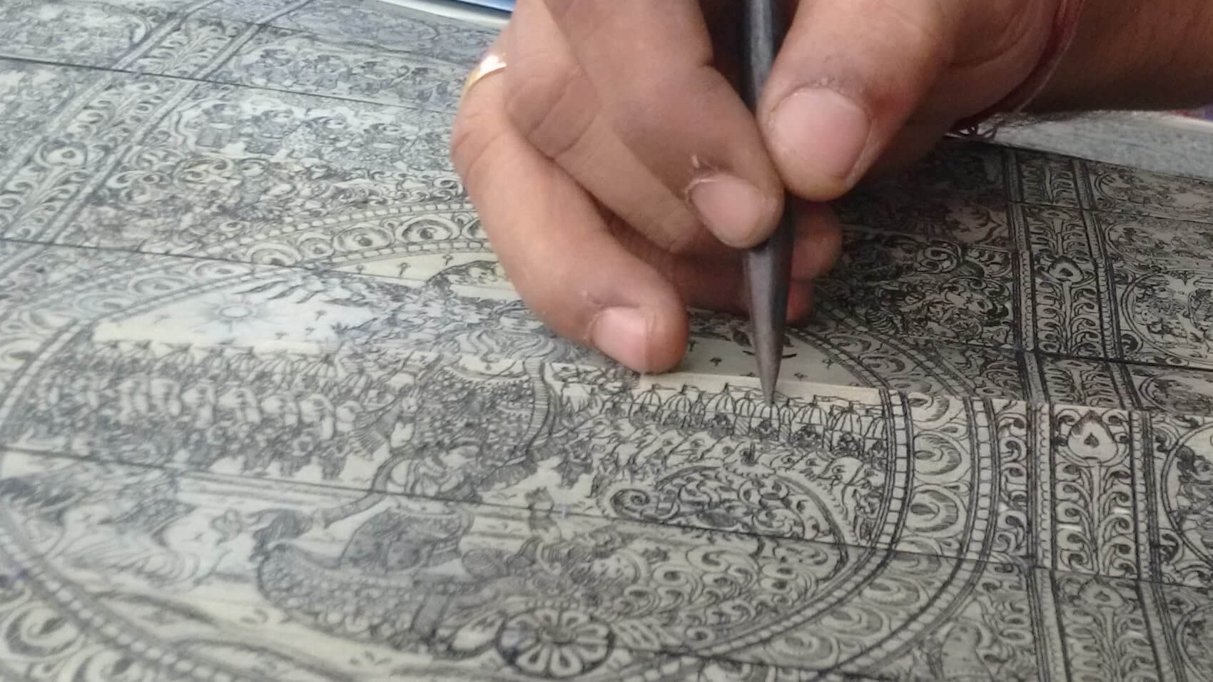Engraving in action Palm leaf engraving by the artist Mr. Debasish Sahoo