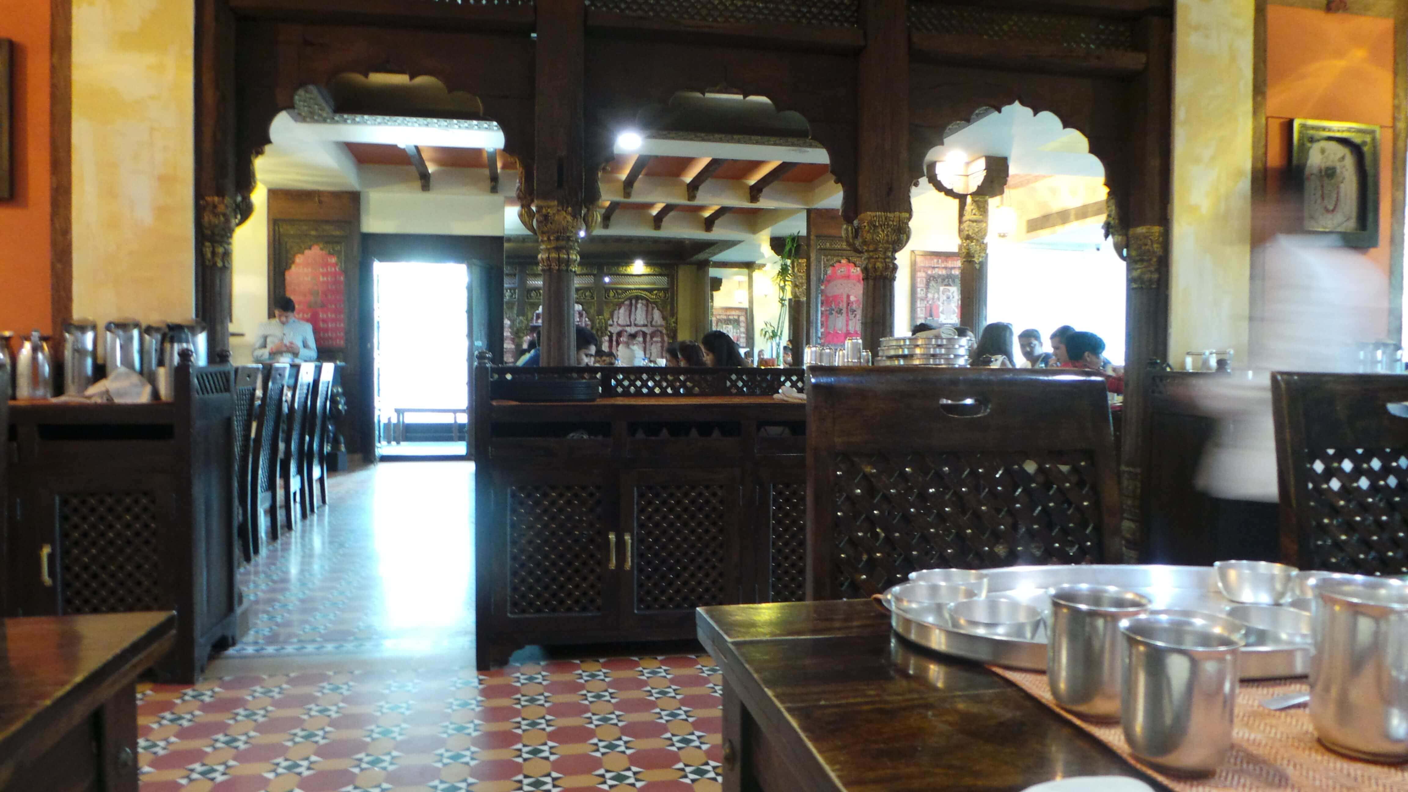 Restored woodwork from Havelis, silverware and beautiful tiles Kesariya, rajasthani restuarant