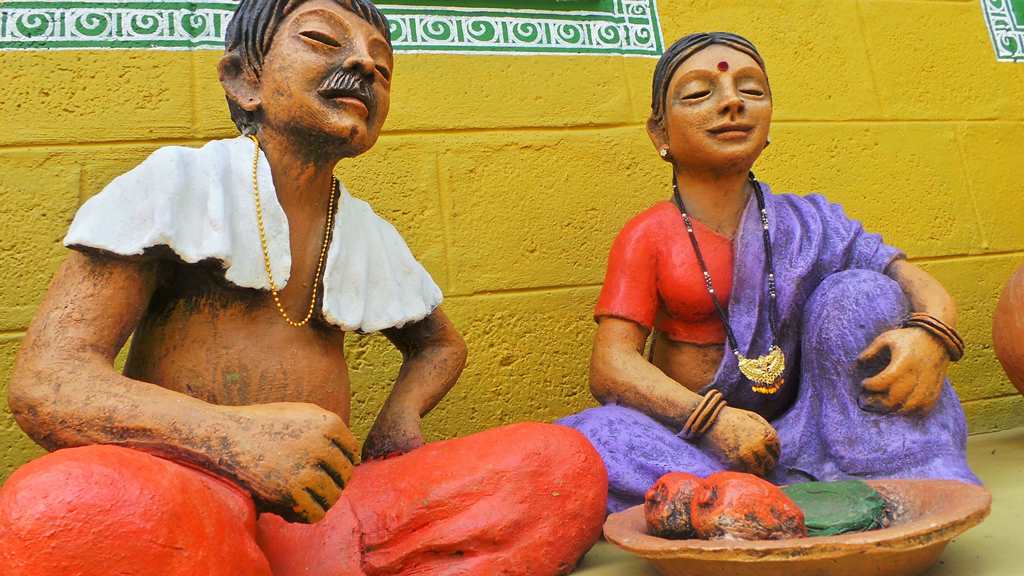 Check out the ornaments added for details.By Terracotta artist Venki Palimar A couple depicting rural life-by Terracotta artist Venki Palimar