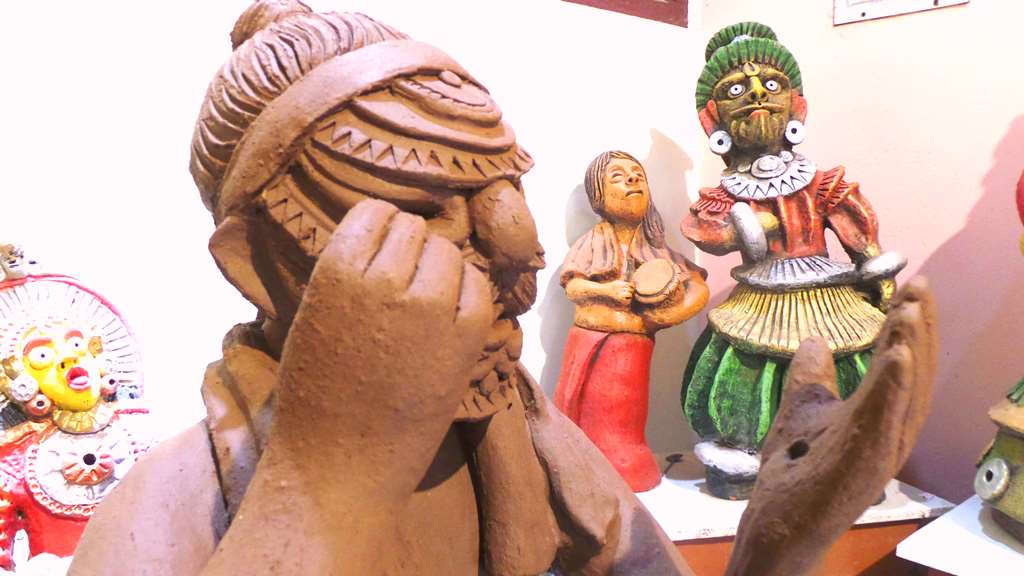 Bhootaradhane, Character applying make-up in terracotta, awaiting baking and painting. Bhootaradhane Character in terracotta at Chitralaya Art gallery-by Terracotta artist Venki Palimar