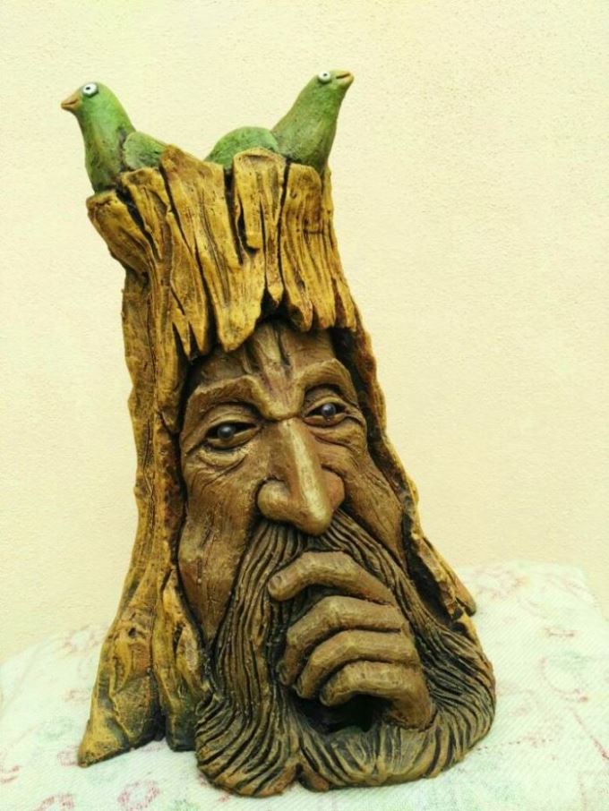 The tree seems deep in thought even as birds make a home. By Terracotta artist Venki Palimar A tree in terracotta at Chitralaya Art Gallery-by Terracotta artist Venki Palimar