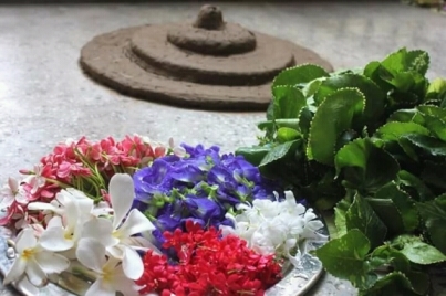 Pookkalam with a base in mud