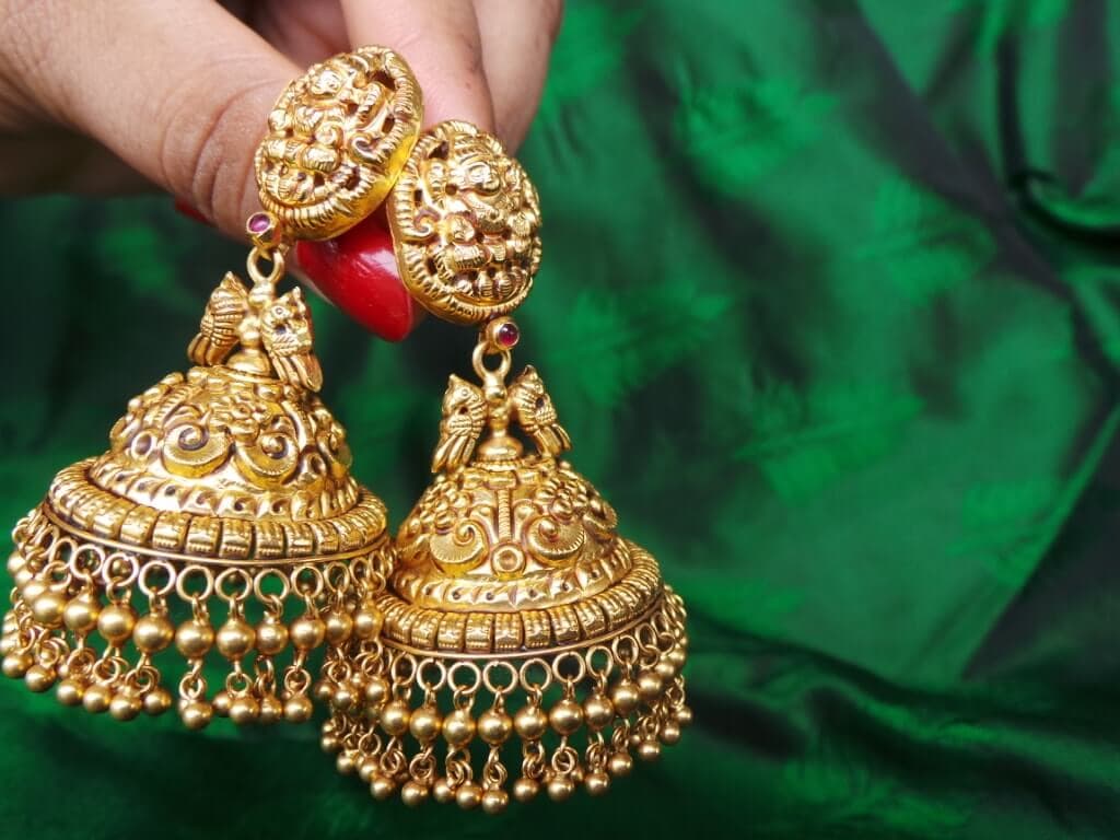 The parrots, Goddess Lakshmi and intricate Jhumkas Swarna Jewellers