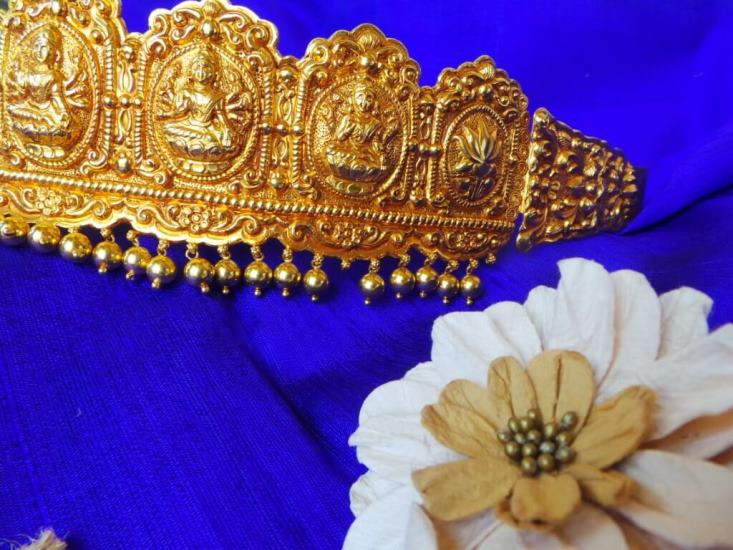 A waistband with Ashtalakshmi and Lotus Swarna Jewellers