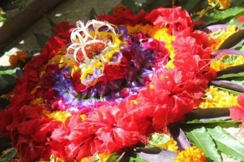 Pookkalam with a base in mud Pookkalam with a base in mud