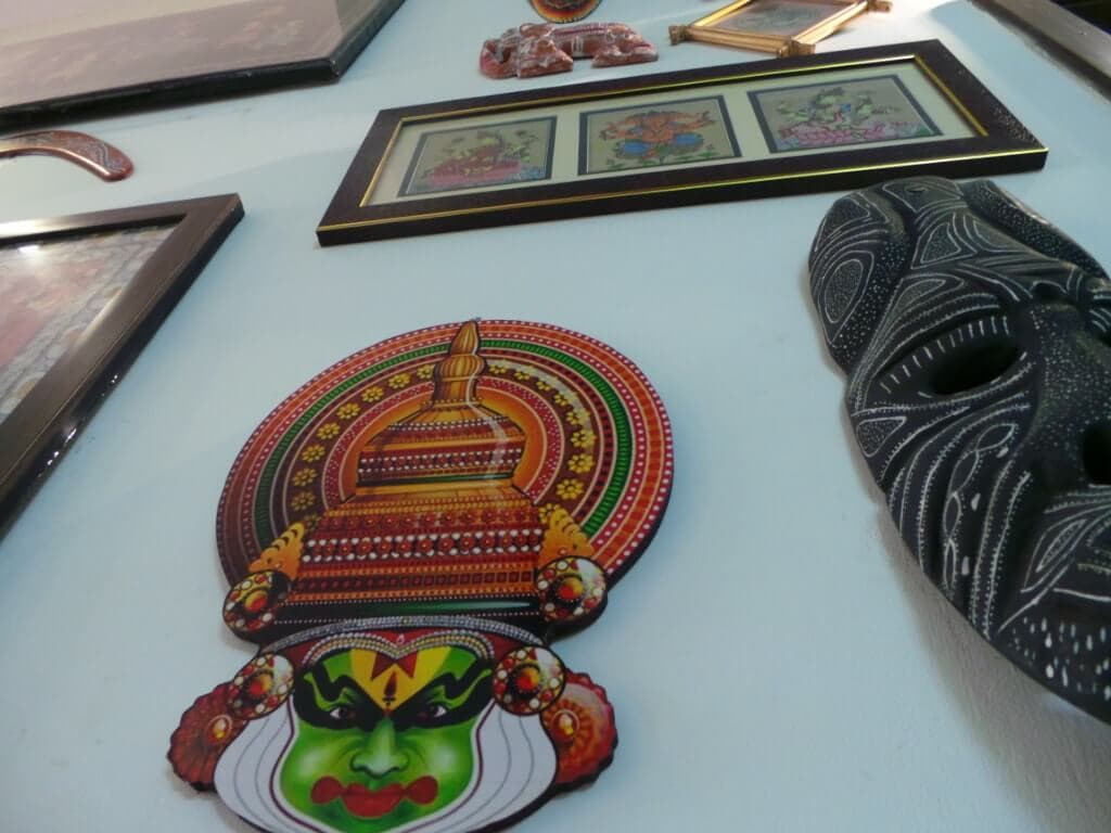Masks, displays and paintings in harmony Gallery wall for Diwali
